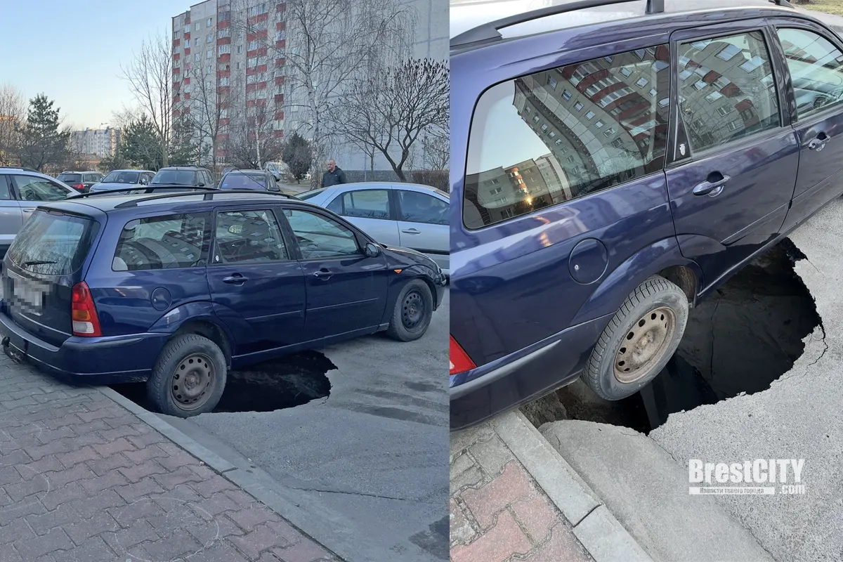 Брест. На парковке под машиной провалился асфальт   колесо повисло в воздухе